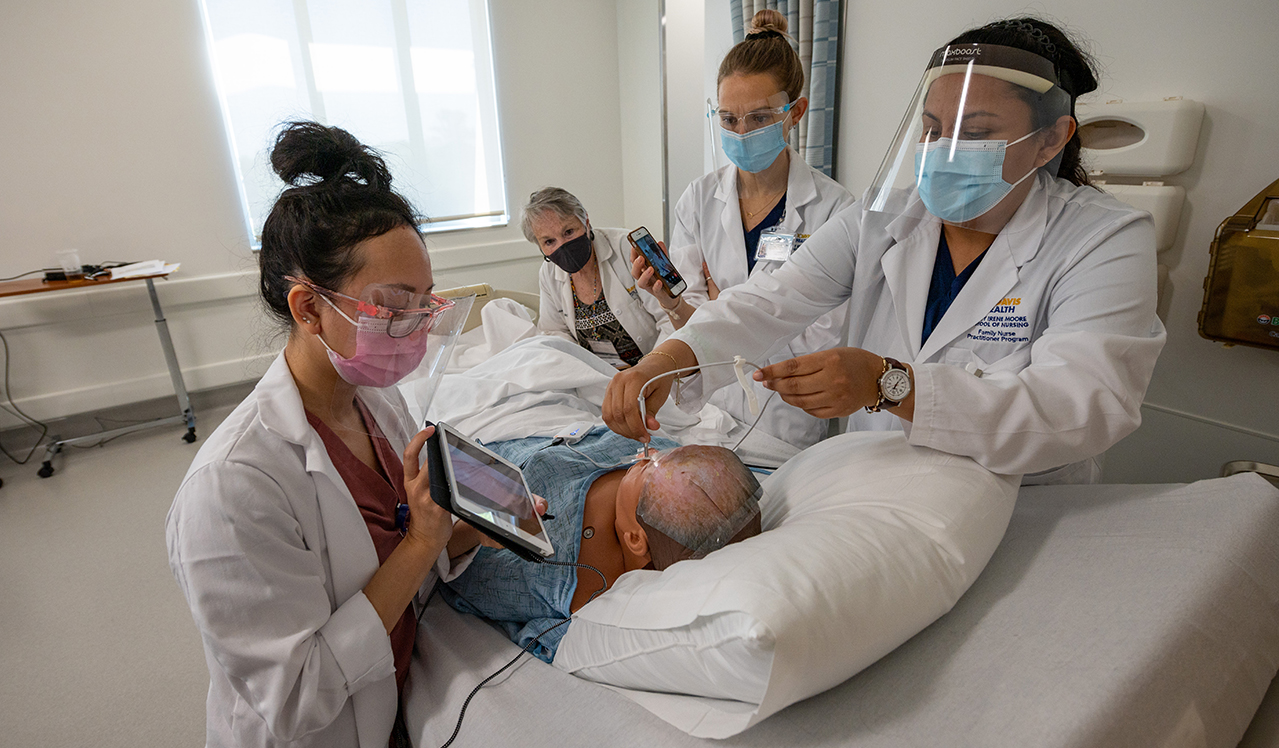 Assistant Professor Laura Van Auker guides nurse practitioner students